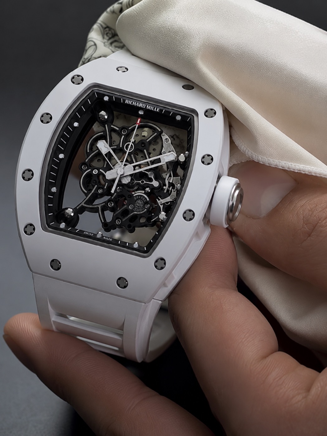 A white ceramic skeleton Richard Mille presented on a polishing cloth